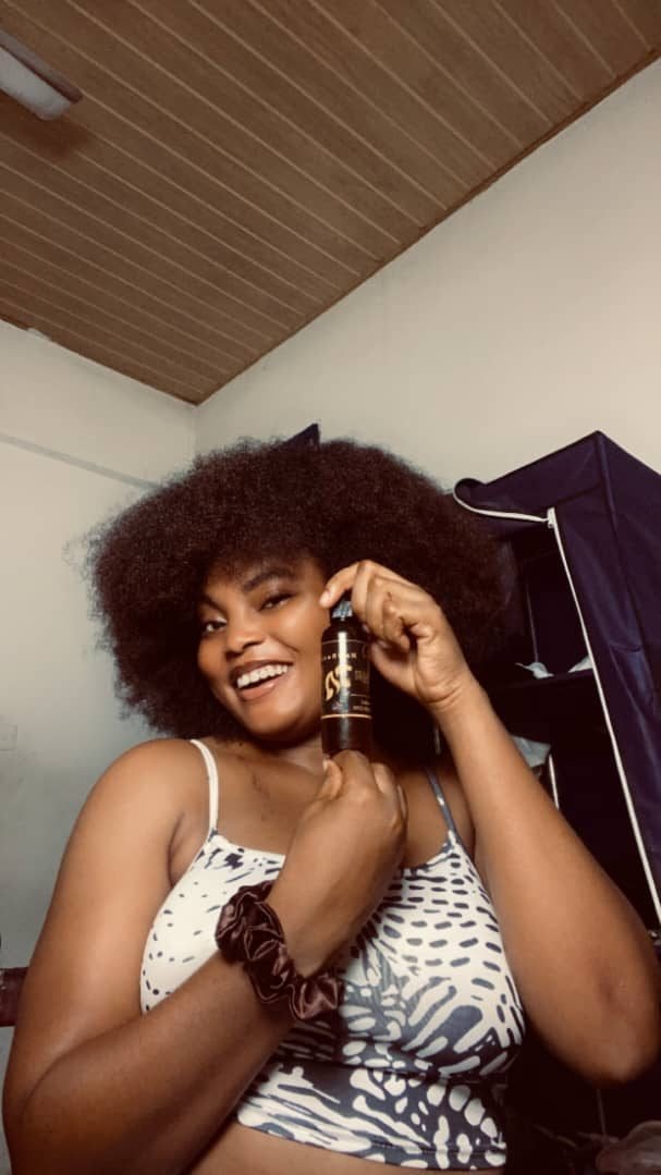 Happy HairRush customer with full natural hair