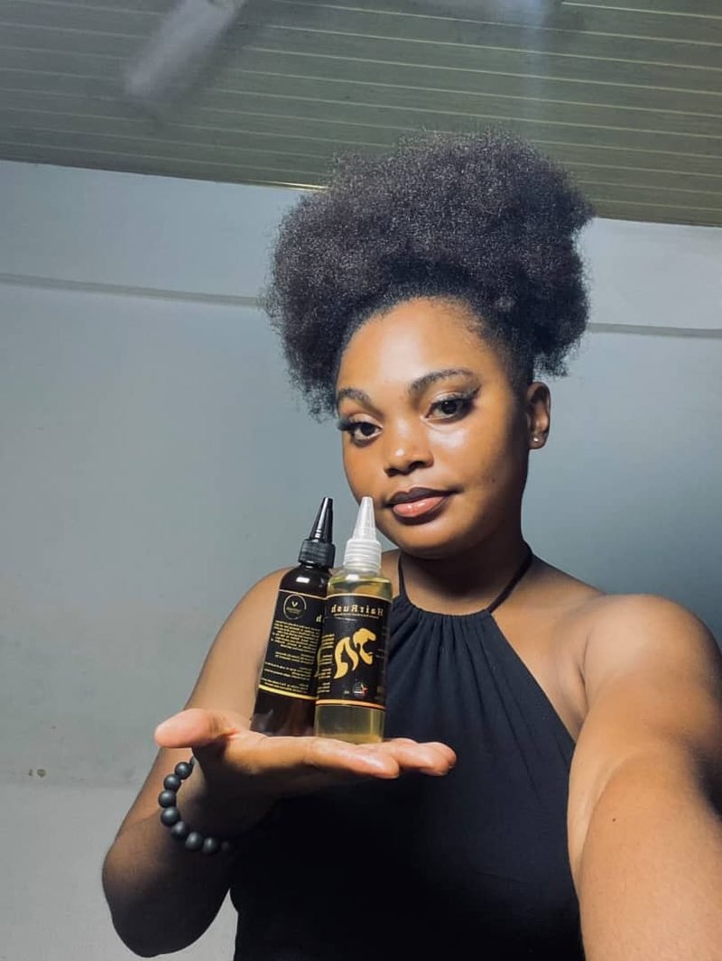 HairRush customer holding two bottles